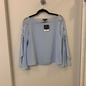 Light blue top